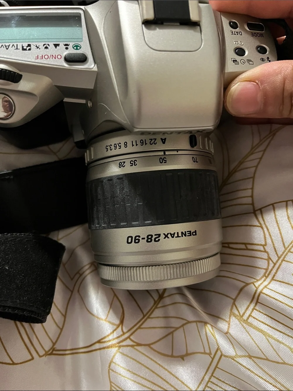 Pentax Silver and Black DSLR with 28-90mm Zoom Lens and Branded Strap